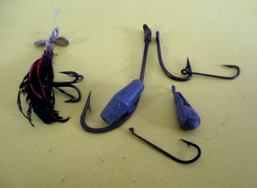 A lot vintage fishing tackle stuff in a very old "Black Magic" tin