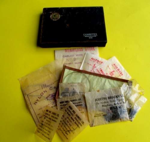 A lot vintage fishing tackle stuff in a rare very old "Players Navy Cut"  cigarette tin.