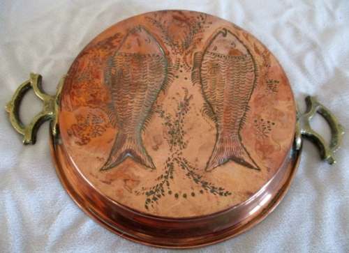 A stunning copper plated pan with brass hanging hooks.