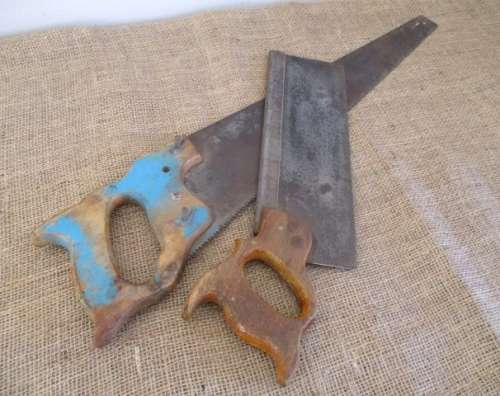 Two very old good buddies !!!    Two Vintage handsaws with wooden handles. One small and one large.
