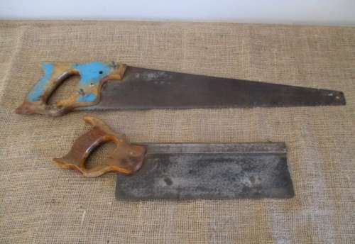 Two very old good buddies !!!    Two Vintage handsaws with wooden handles. One small and one large.