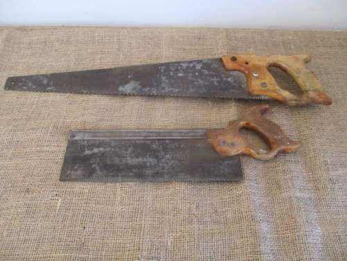 Two very old good buddies !!!    Two Vintage handsaws with wooden handles. One small and one large.