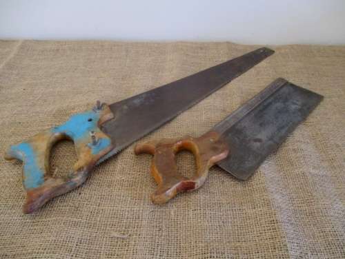 Two very old good buddies !!!    Two Vintage handsaws with wooden handles. One small and one large.