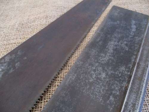 Two very old good buddies !!!    Two Vintage handsaws with wooden handles. One small and one large.