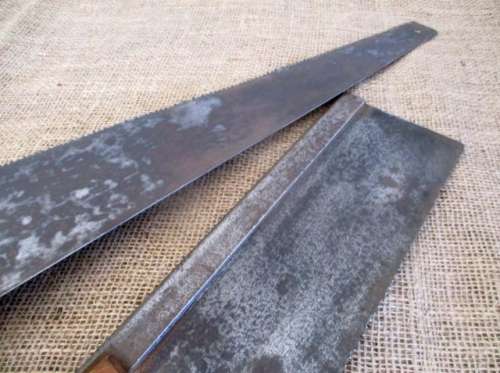 Two very old good buddies !!!    Two Vintage handsaws with wooden handles. One small and one large.