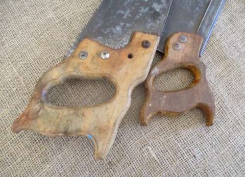 Two very old good buddies !!!    Two Vintage handsaws with wooden handles. One small and one large.