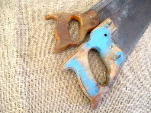 Two very old good buddies !!!    Two Vintage handsaws with wooden handles. One small and one large.