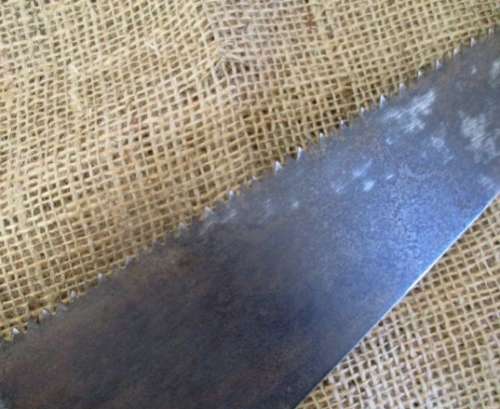 Two very old good buddies !!!    Two Vintage handsaws with wooden handles. One small and one large.