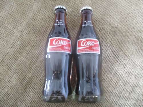 Two Sealed 200ml Coca Cola "Return For Deposit" Bottles And Two Carafies