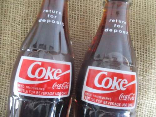 Two Sealed 200ml Coca Cola "Return For Deposit" Bottles And Two Carafies