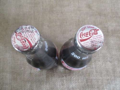Two Sealed 200ml Coca Cola "Return For Deposit" Bottles And Two Carafies