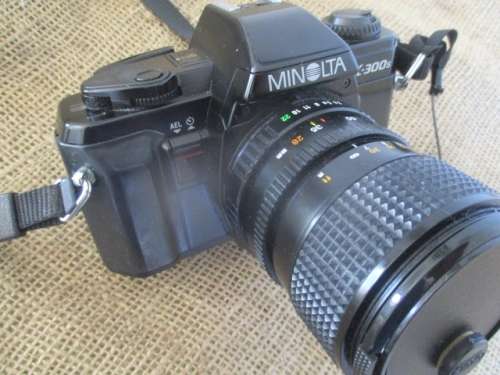 Popular Vintage Minolta X-300s SLR Camera With Film And Attached Minolta MD Zoom 28 - 70 mm Lens