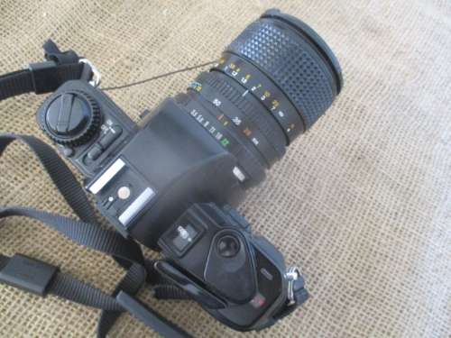Popular Vintage Minolta X-300s SLR Camera With Film And Attached Minolta MD Zoom 28 - 70 mm Lens