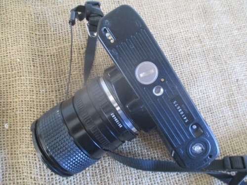 Popular Vintage Minolta X-300s SLR Camera With Film And Attached Minolta MD Zoom 28 - 70 mm Lens