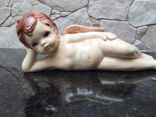 A Cute Resting Cherub Ceramic Ornament