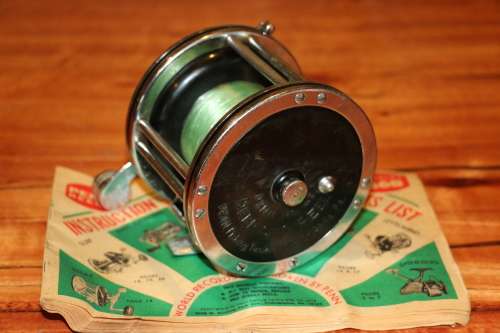 Vintage Penn 49 Fishing Reel (USA) with Catalog