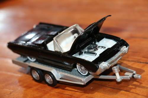 Vintage SOLIDO Diecast Model Car on a Metal Diecast Trailer