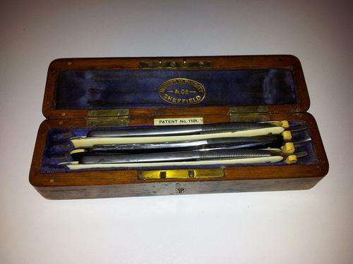 3 vintage Cutthroat razors in a wooden box