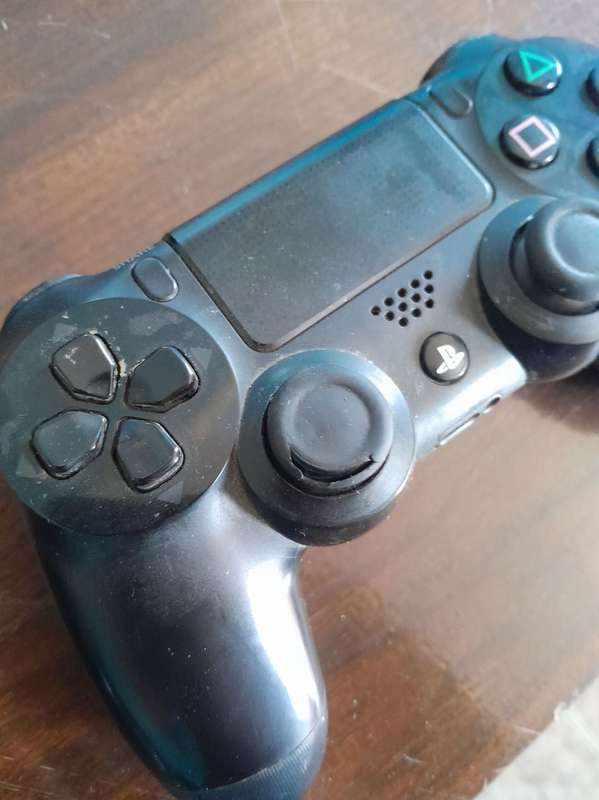 Pre owned ps4 SLIM with 2 games and cooling fan with charging port
