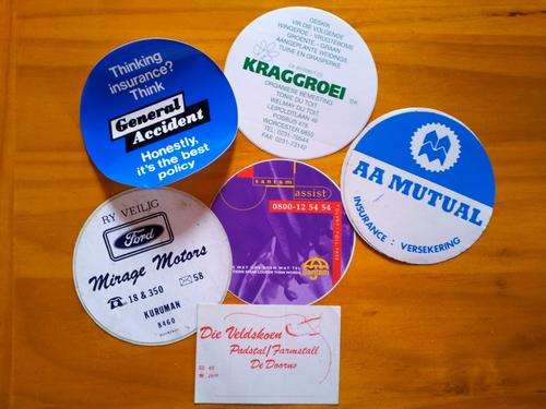 Vintage motoring-related stickers