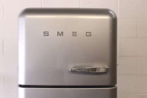 A silver original Smeg (model FAB30S7) "50's Retro Style Aesthetic" fridge-freezer combo