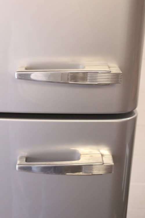 A silver original Smeg (model FAB30S7) "50's Retro Style Aesthetic" fridge-freezer combo