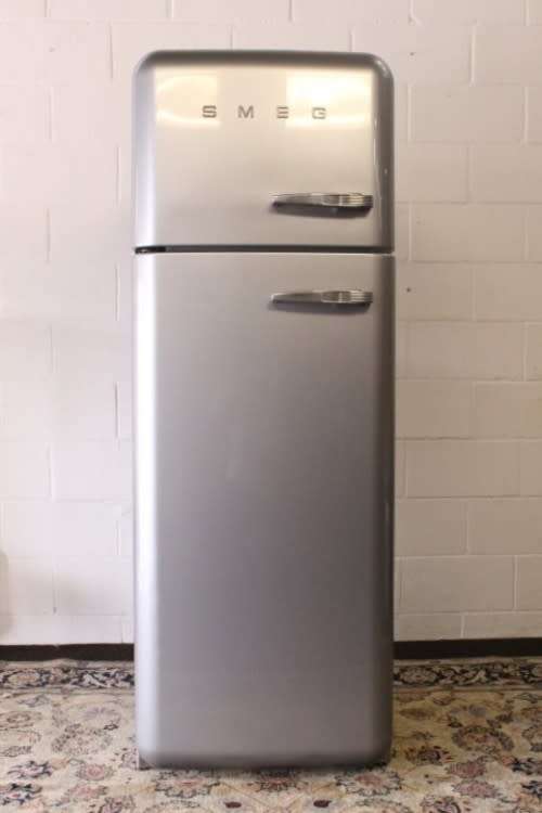 A silver original Smeg (model FAB30S7) "50's Retro Style Aesthetic" fridge-freezer combo