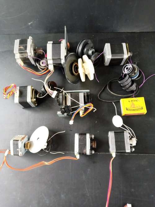 Stepper motors with some drive gears and belts joblot of 8 motors (used)