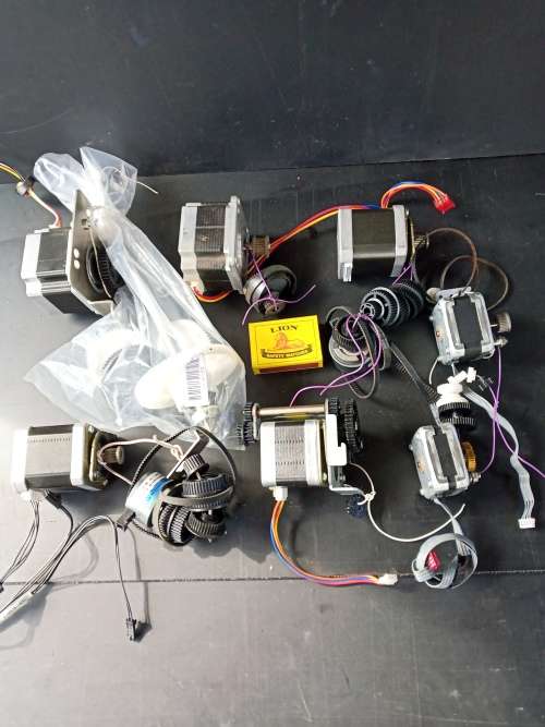 Stepper motors with some drive gears and belts, joblot 7 motors (used)