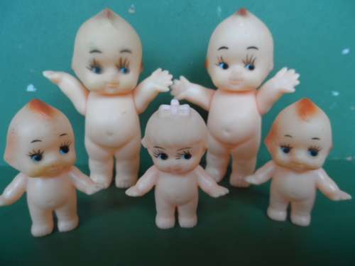 Beautiful Kewpie doll family all with wings in miniature