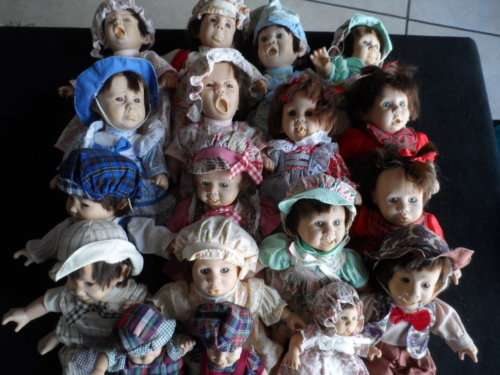 VERY CUTE 18 DOLLS ALL DIFFERENT EXPRESSIONS THREE OF THEM ARE THE SMALLER VERSION