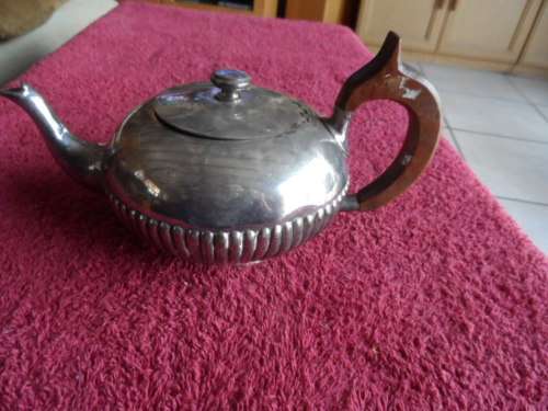 Beautiful old silver teapot uncleaned with wooden handle