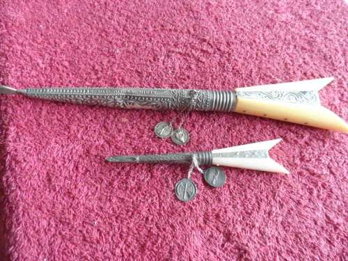 One large and one small knives in their holders