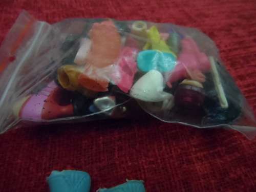 Barbie dolls shoes and bag of oddment shoes