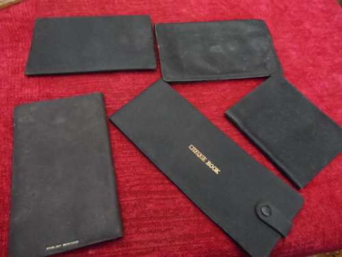 Vintage leather wallets  and a checkbook holder all in good condition.