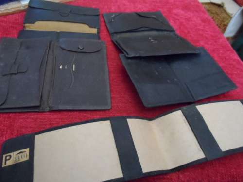 Vintage leather wallets  and a checkbook holder all in good condition.