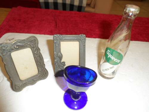 Vintage blue eye glass old miniature cooldrink bottle and miniature pewter like frames self standing