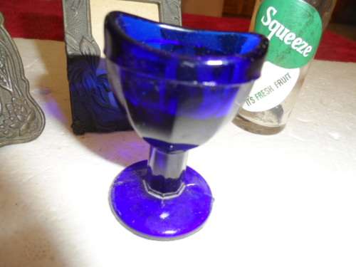 Vintage blue eye glass old miniature cooldrink bottle and miniature pewter like frames self standing