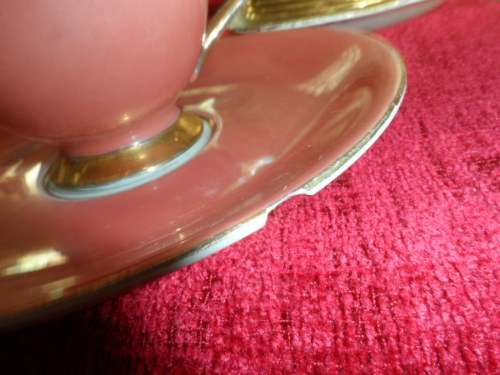 Unusual 6 cup and saucers three with matching sideplates.