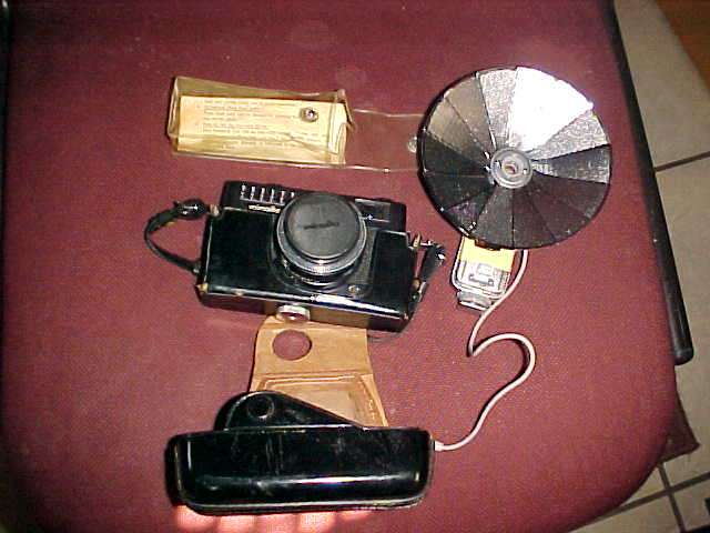 MINOLTA CAMERA AND ASTER FLASH GUN