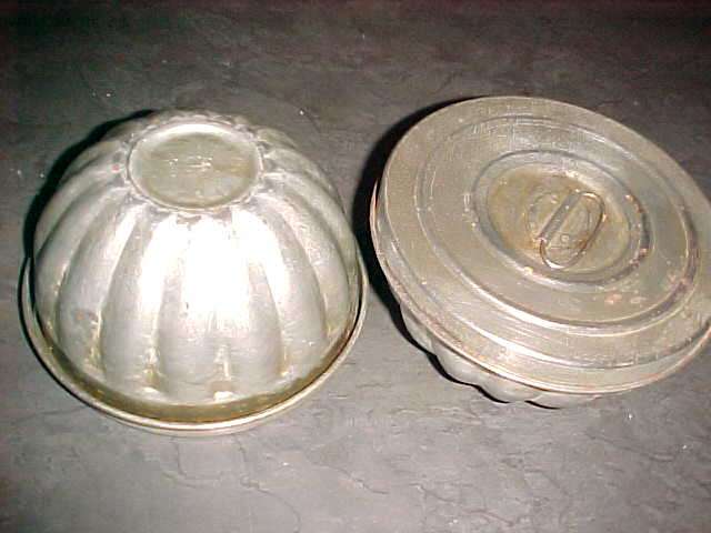 Most unusual pair of aluminum moulds with lids