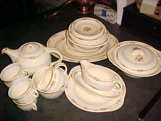 Part dinner service and teapot Woods ivory ware England.