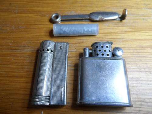 TWO LIGHTERS UNTESTED VERY OLD WITH SPARE FLINTS AND PIPE CLEANER