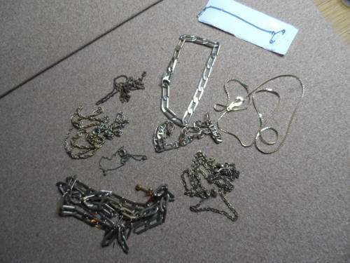 Bag of odd chains.  Cannot say if there is any real gold or not.