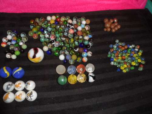 Huge Marble collection Ironies and glass and lion king small to large .  lovely collection