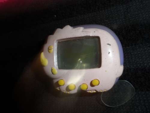 Vintage Tamagochi untested no batteries with original tab on/off