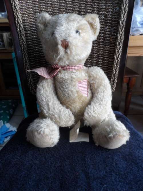 Beautiful vintage Russ bear with checkered heart and bow.  Sitting and quite large