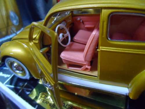 BBURAGO VW BEETLE GOLD 1,000,000 WITH SALMOM\N SEATS.  1/18 SCALE
