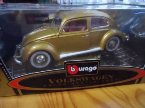 BBURAGO VW BEETLE GOLD 1,000,000 WITH SALMOM\N SEATS.  1/18 SCALE