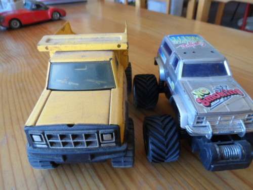 BUDDY L PRESSED METAL TIP TRUCK AND PLASTIC MONSTER TRUCK